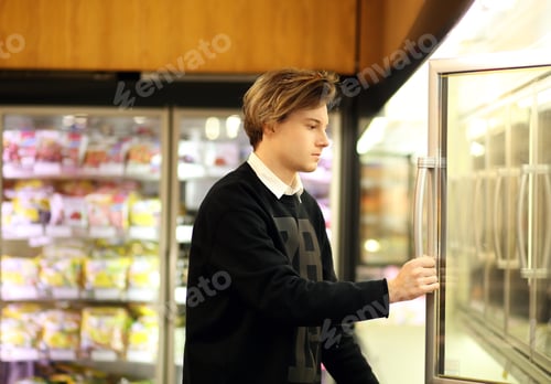 Preview: Man Shopping In Supermarket, Reading Product Information