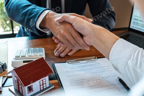 Preview: Real estate agent are shaking hands after good deal and giving house