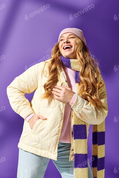 Preview: Joyful plus size woman in stylish winter outfit posing against vibrant purple backdrop