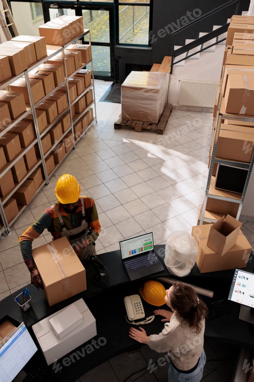 Preview: Stockroom team standing at counter desk in storage room