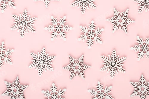 Preview: Christmas background. White snow decorations on a pink background.