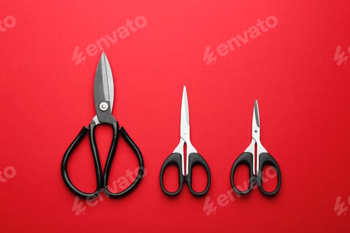 Preview: Set of different scissors on color background, flat lay