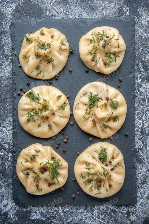 Preview: top view raw little dumplings little dough pieces on gray background cuisine dish meat dough cake