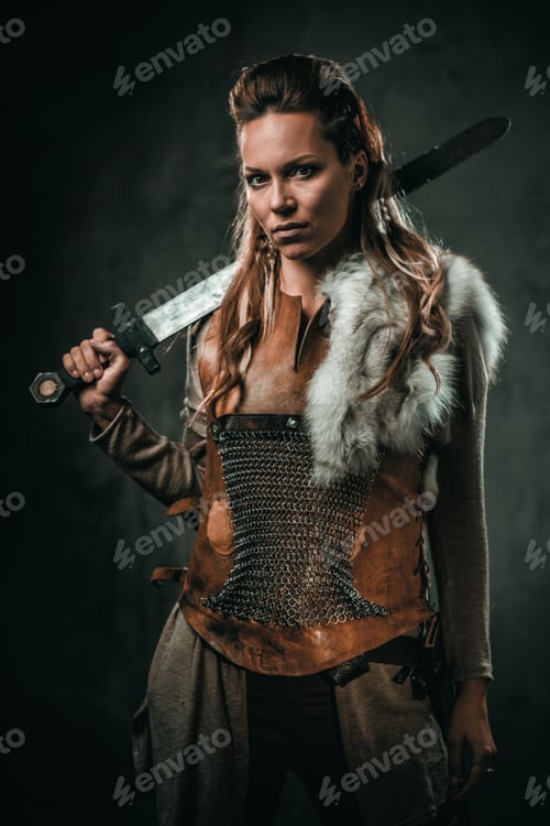 Preview: Confident Woman Warrior Posing with Sword and Armor