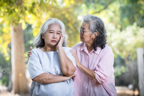 Preview: Senior women touching shoulder comforting senior friend.Quality of Friendship concept.