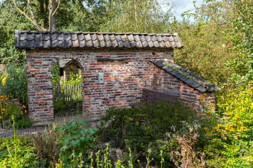 Preview: ruin of an old stone shed with an arch as entrance