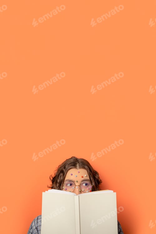Preview: Female student reading book.