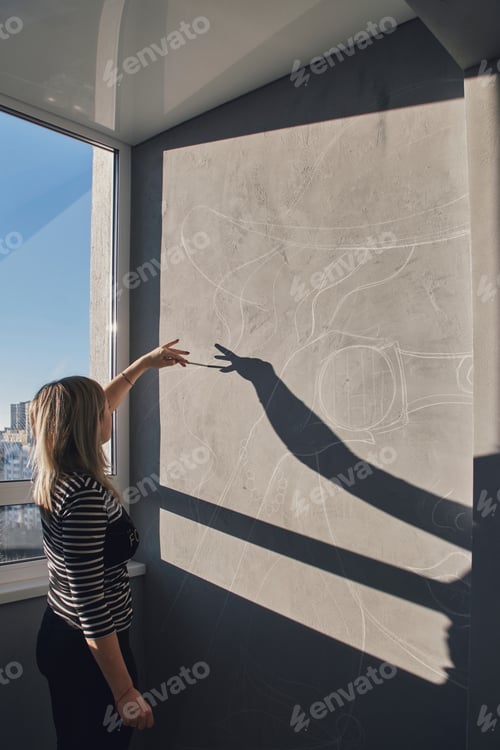 Preview: Girl artist paints a picture of pop art on the wall