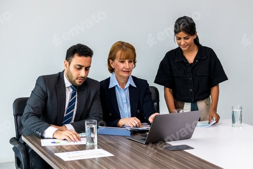 Preview: Diverse colleagues gather in brainstorm discuss statistics together.