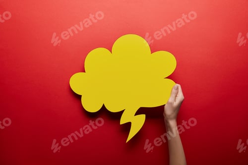 Preview: top view of empty yellow thought bubble on red background