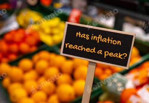 Preview: Wooden information label sign with text HAS INFLATION REACHED A PEAK against defocused store shelves