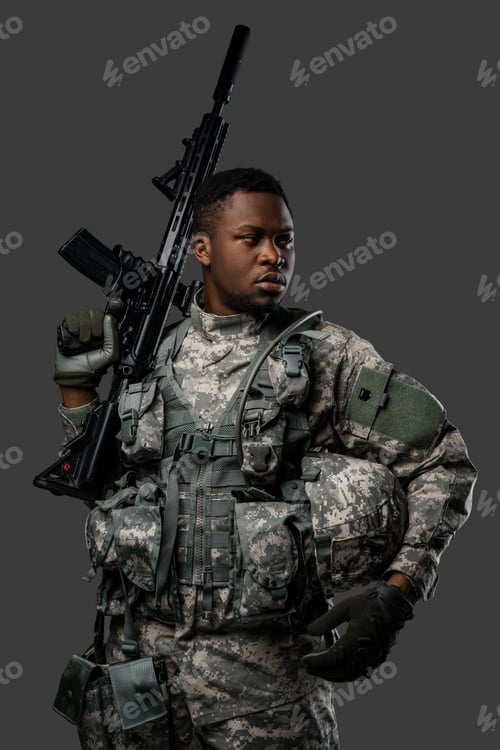 Preview: Courageous black soldier holding rifle on his shoulder