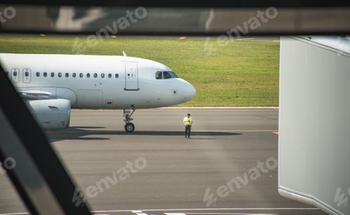 Preview: Passenger jet taxiing on the runway, getting ready to take off.