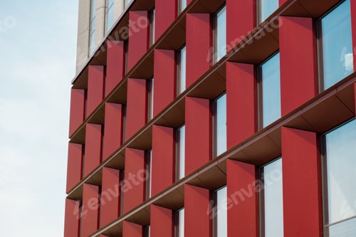 Preview: Modern office building exterior with glass facade on clear sky background. Transparent glass wall of
