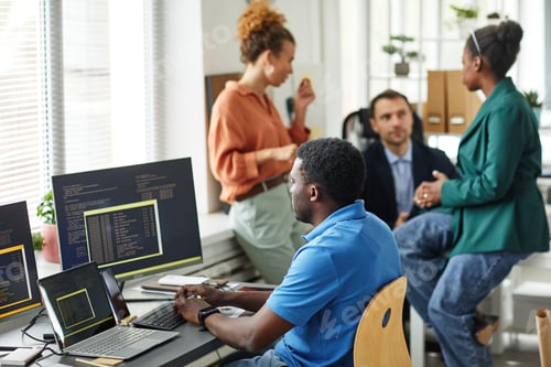 Preview: IT specialist developing software at office