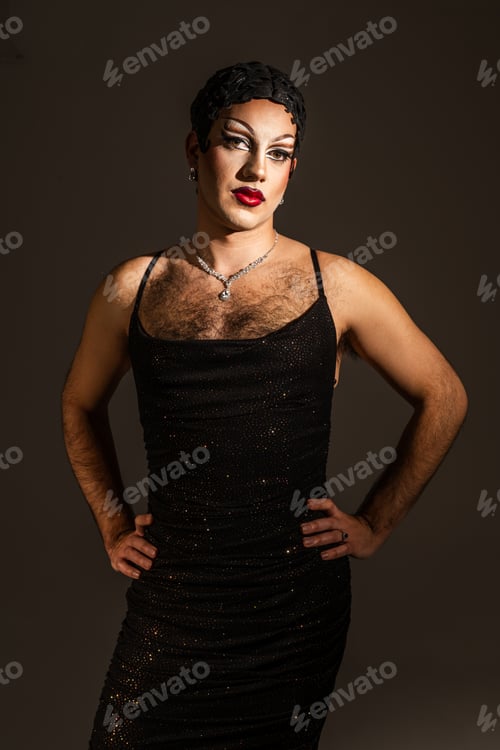 Preview: Latina Drag Queen Poses Confidently in a Studio Portrait, Showcasing Bold Makeup and Fashion