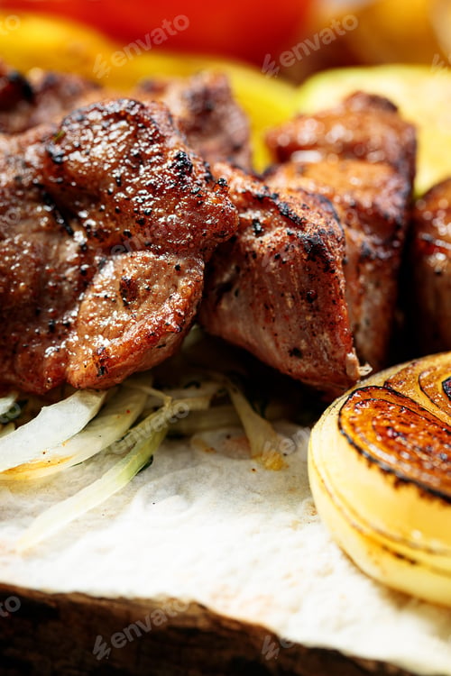 Preview: Appetizing grilled meat. Assorted vegetables. Close-up. Vertical shot. Copy space