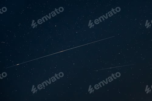 Preview: Two Meteoric Tracks In The Blue Night Starry Sky Background. Nat