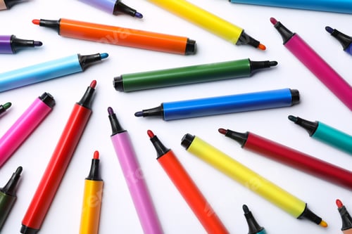 Preview: Flat lay composition with colorful markers on white background. Rainbow palette