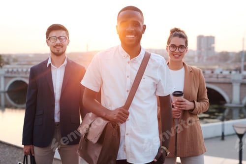Preview: Young successful African leader of business team looking at you with smile