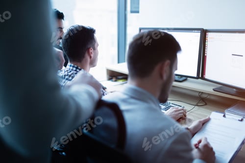 Preview: Group of business people and software developers working
