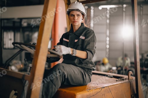 Preview: Female robotic technician schedules maintenance and runs forklift, in inclusive workplace.
