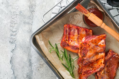 Preview: Pork ribs. Raw meat. Raw pork ribs in marinade with spices, rosemary, tomato sauce and garlic on old