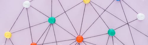 Preview: panoramic shot of colorful push pins connected with strings Isolated On pink, network concept