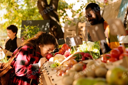 Preview: Consumer sniffing apples at fair festival