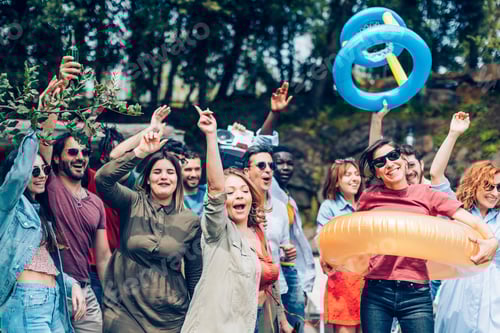 Preview: Friends enjoying a lively outdoor party, dancing and celebrating together