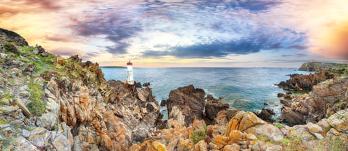 Preview: Panoramic view of sunrise over Capo Ferro Lighthouse.