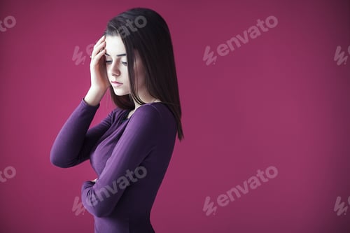 Preview: Young tired woman on pink background with copy space