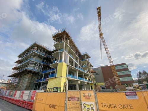 Preview: Wide angle looking up at a new wing being built at a construction site