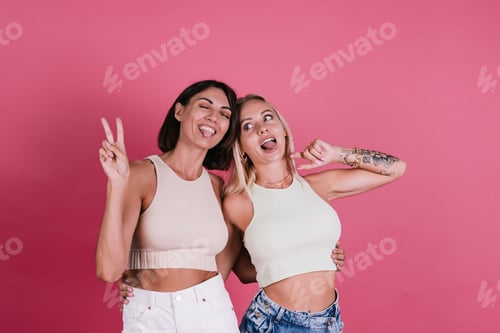 Preview: Two girl friends in casual on pink background