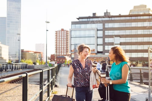 Preview: Two friends enjoying a sunny day in the city