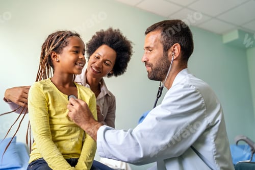Preview: Healthcare medical exam people child concept. Close up of happy girl and doctor with stethoscope