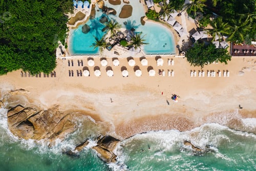 Preview: Aerial top view of first line beach hotel resort, with outdoor pool and sun loungers