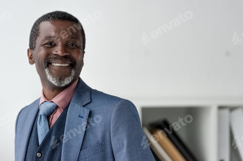 Preview: smiling mature african american man in blue jacket