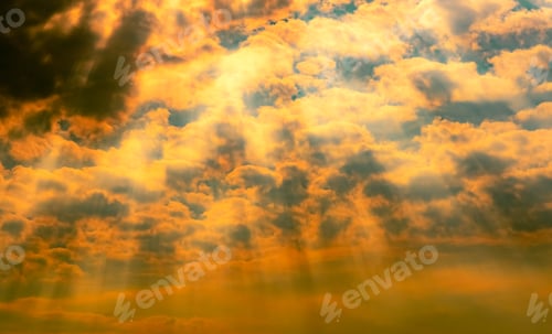 Preview: Golden Sunlight Streaming Through Fluffy Cloudscape