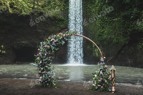 Preview: Round metal wedding arch decorated with purple and green flowers on Tibumana