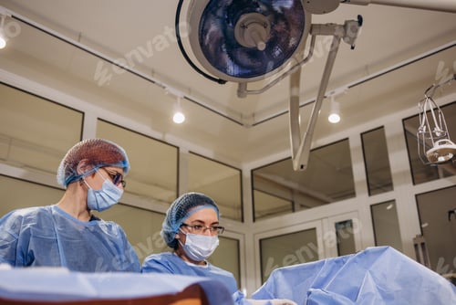 Preview: doctor and an assistant in the operating room for surgical venous vascular surgery clinic