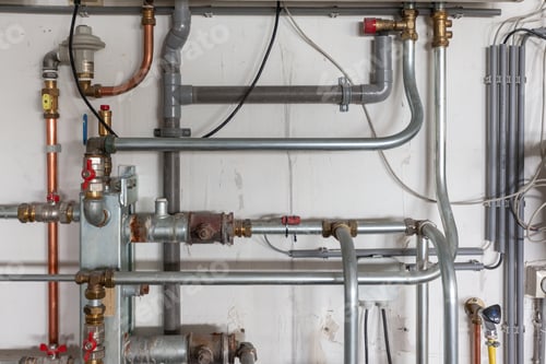 Preview: Closeup shot of pipes and valves of a central heating system