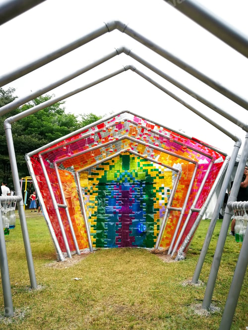 Preview: recycled items made into art. walking into fun portal