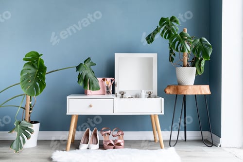 Preview: Stylish room interior with elegant dressing table and plants