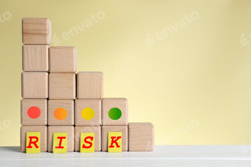 Preview: Risk. Quantity of cubes showing level of risk against beige background