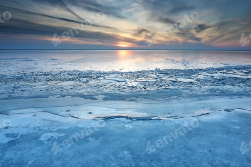 Preview: big lake frozen at sunset