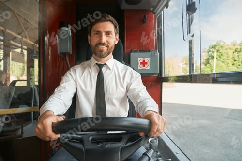 Preview: Cheerful elegant bus driver steering wheel at sunny morning.