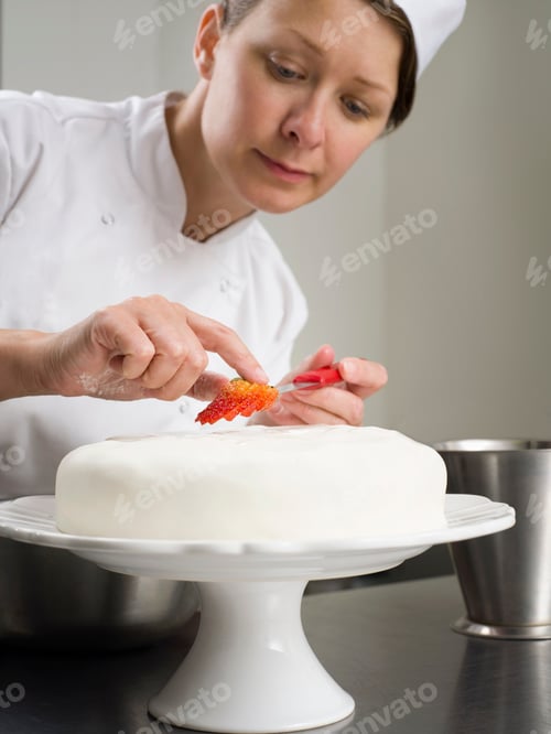 Preview: A female chef cake decorating