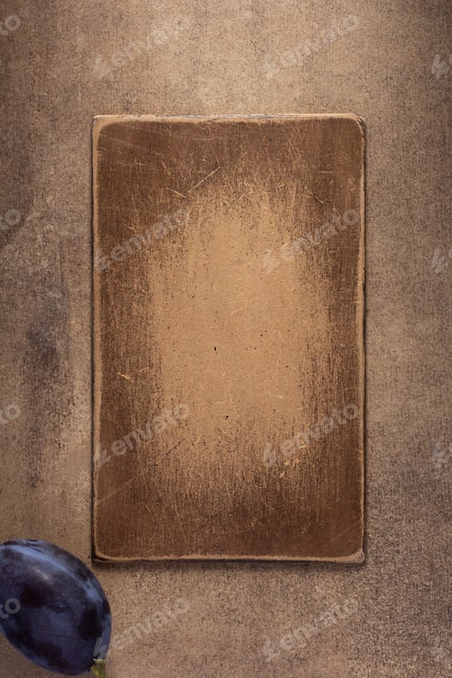 Preview: Wooden nameplate and plum at table background. Front view of name plate
