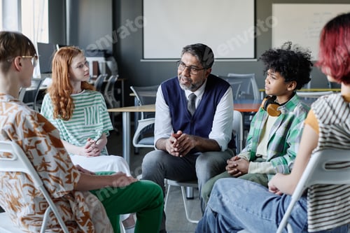 Preview: Psychologist Talking To Group Of Teenagers